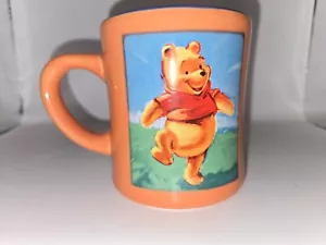 The Disney Store Winnie the Pooh Coffee Mug Orange w/ Yellow Interior Tea Cup - Picture 1 of 5