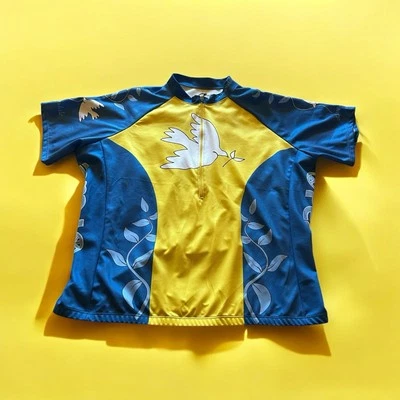 CAMISETA DE CICLISMO CANNONDALE PEACE WORLDWIDE GRANDE AMARILLA, AZUL, BLANCA Foto 1 de 4