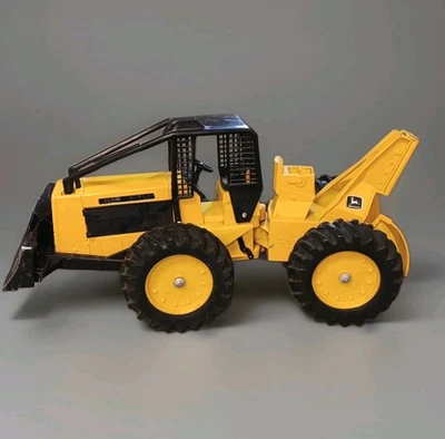 Trattore giocattolo vintage ERTL John Deere Log Skidder modello 590 scala 1/16 giallo - Immagine 1 di 4