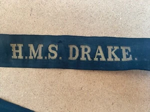 H.M.S. DRAKE. Original Cap Tally Anfang 1900 mit Messingdrahtschrift und Punkt. - Bild 1 von 4