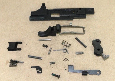 WALTHER P22 TRIGGER ASSY, EJECTOR, PIN, SPRING, HAMMER, SLIDE CATCH, SIDEPLATE. - Image 1 of 4