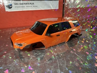 Pro-Line Axial SCX24 2024 Toyota 4Runner TRD Pro Hard Body Orange Complete W/led - Image 1 of 4