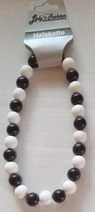 Halskette schwarz-weiss, 28 Perlen, Kunststoff, mit Gummizug - Bild 1 von 1