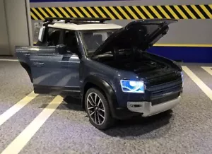 Modellino Land Rover New Defender 110 2020 blu tutte le porte luci aperte scala 1:32 - Foto 1 di 7