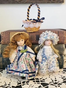 Lote de 2 muñecas de porcelana con cesta  - Imagen 1 de 11