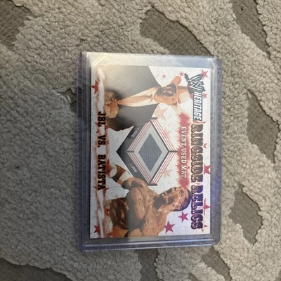 2005 TOPPS WWE HERITAGE JBL VS. BATISTA RINGSIDE RELICS EVENT USED MAT Chrome  - Image 1 of 4