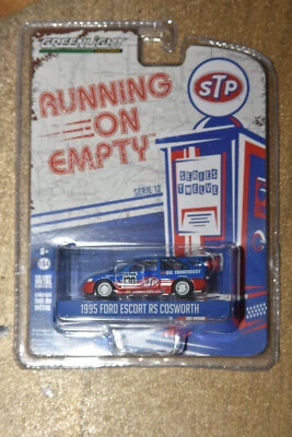 Ford Escort RS Cosworth STP modelo coche funcionando vacío 1:64 luz verde 41120-E Foto 1 de 2
