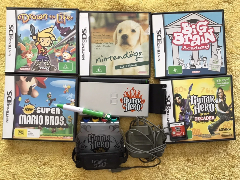 NINTENDO DS LITE GUITAR HERO CONSOLE BUNDLE WITH 6 GAMES - image 1 of 4