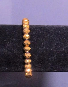 Pulsera elástica con cuentas facetadas en marrón - Imagen 1 de 5