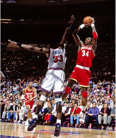 Hakeem Olajuwon Houston Rockets Unsigned Red Jersey Shooting Photograph Cover