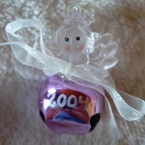2004 Plastic Angel With Ribbon And Purple Metal Bell Christmas Ornament - Picture 1 of 2