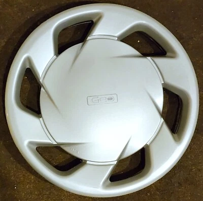 (1) Tapacubos cubierta de rueda izquierda #0A 8970239810 Geo Storm 1991-93 original nuevo de stock Foto 1 de 4