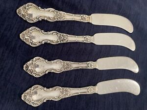 4 Sterling Silver Butter Spreaders in the Meadow Rose Pattern by Wallace