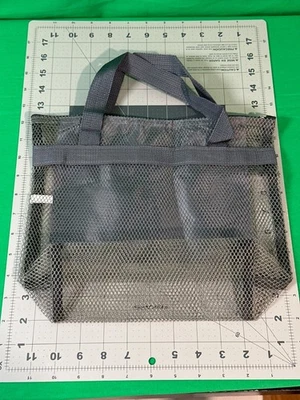 Bolsa de ducha de malla con asas dobles y múltiples bolsillos para organización Foto 1 de 2