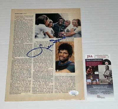 Leon Spinks signed Boxing Magazine Page Heavyweight Champ autographed JSA - Image 1 of 2