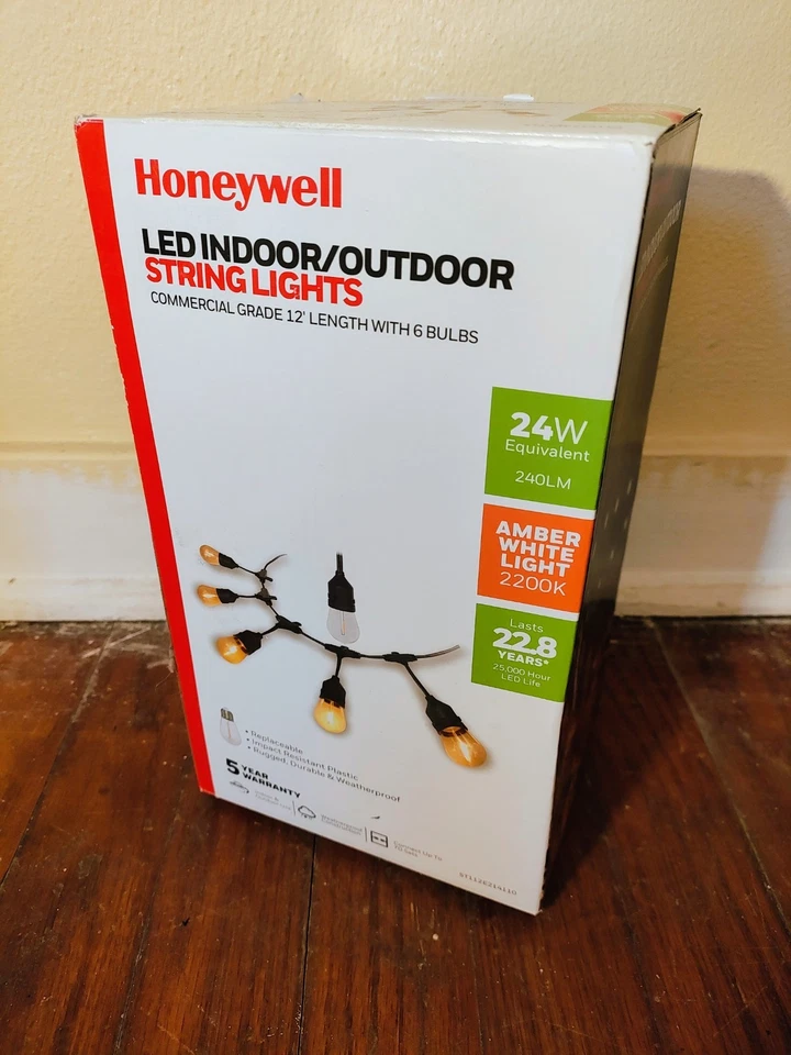 Cadena de luces LED enchufables para exteriores Honeywell 12' 6 bombillas Edison blanco cálido Foto 1 de 2
