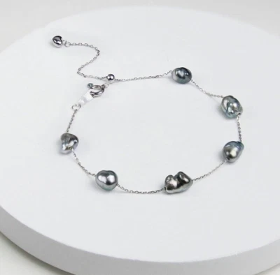 Pulsera de perlas negras de Tahití de 9 mm, diseño barroco de oro de 18 quilates con detalles en plata Foto 1 de 4