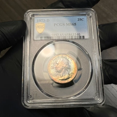 MS65 1973-D 25C Washington Quarter, PCGS Secure- Rainbow Album Toned Cover