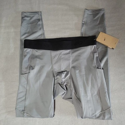 Pantalones de compresión Nike para hombre grandes profesionales cálidos grises FB7961-084 PRECIO DE VENTA SUGERIDO POR EL FABRICANTE $55 Foto 1 de 4