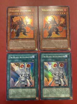 Yugioh - Volcanic Doomfire FOTB-EN008 + Tri-Blaze Accelerator FOTB-EN041 1st X2 - Image 1 of 4