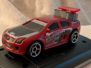 Preciosa máquina Ford Fusion 2006 de Mattel alerón de 2 posiciones hecha para MCD - Imagen 1 de 22