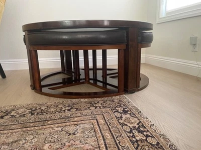 Brown Coffee Table with leather pull out stools. Used - Image 1 of 4