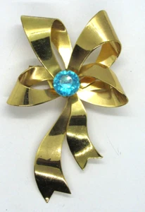 Vintage Large Polished Gold Tone Light Blue Rhinestone Bow Brooch Pin - Picture 1 of 7