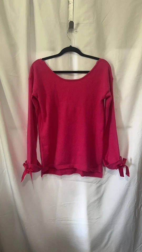 Suéter con espalda abierta acanalada rosa magenta con puños de corbata Foto 1 de 4