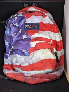 Zaino Jansport bandiera americana High Stakes multi grunge chiusura zip pulito in ottime condizioni - Foto 1 di 11