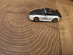 Coche Micro Scalextric Nissan 350z Necesidad de Velocidad Funcionando 1:64 - Imagen 1 de 4