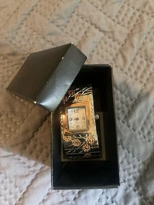 VINTAGE AVON MANSCHETTENARMBANDUHR MIT BLUMEN SILBERFARBENE HANDSCHALTUNG INKLUSIVE - Bild 1 von 7
