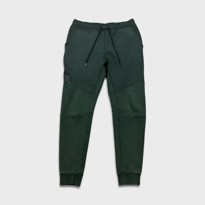 Pantalones deportivos Nike para hombre pequeños verde tecnología polar Swoosh pierna cónica jogger Foto 1 de 4