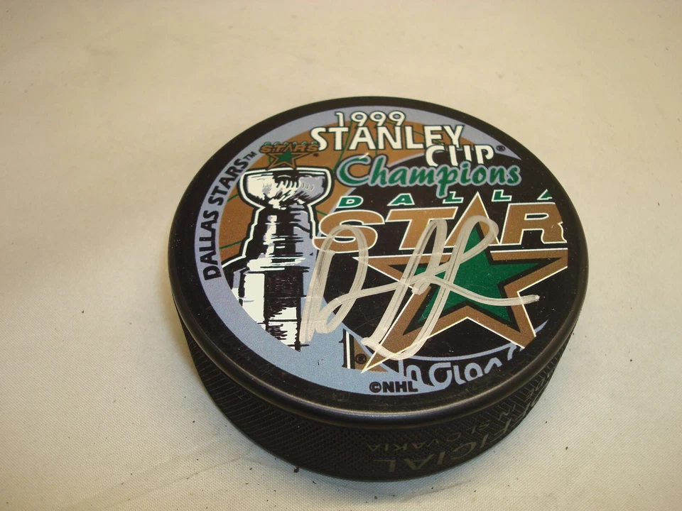 Darryl Sydor Firmado Dallas Stars 1999 Stanley Cup Champs Hockey Puck Automático 1A Foto 1 de 2
