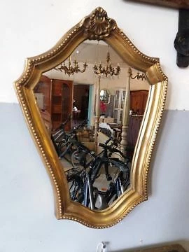 A vintage ,gold wall mirror Cover