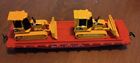 HO scale vintage Great Northern flat car with two CAT D5G XL Track Type Tractors