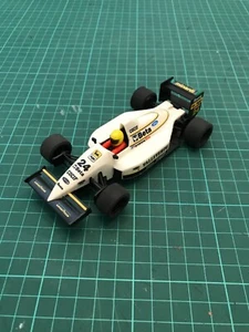 Scalextric type slot car - SCX Minardi F1, 1993 No.24 Pierluigi Martini livery - Picture 1 of 6