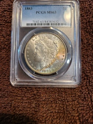 1883 PCGS MS63 toned Morgan Silver Dollar Priced to sell! - Image 1 of 2