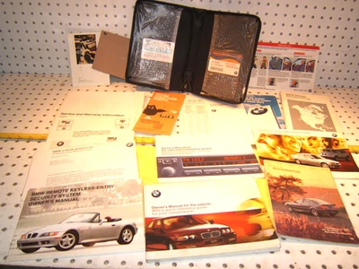 BMW 1999 E46 323 328i dueño 1 juego de 15 manuales/papeles y estuche BMW NEGRO 1 Foto 1 de 4