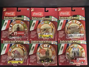 Set 12 auto Johnny Lightning Coca Cola serie internazionale nuove con scatola - Foto 1 di 8