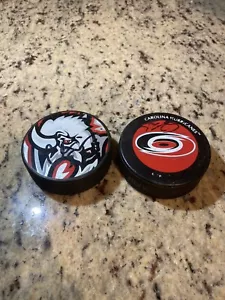 NHL Signed Hockey Pucks - Hurricanes, Buffalo - Picture 1 of 3