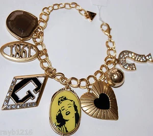 Neu mit Etikett Guess *Exklusiv* Gold Metallsteine Vintage Charms Drama Armband - Bild 1 von 10