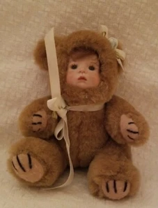 BROWN TEDDY BEAR W/ PORCELAIN FACE HAS RED BANGS 4.75" TALL 3.50 ACROSS, 3" WIDE - Picture 1 of 5