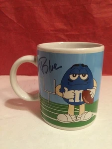 Taza de café M&M azul fútbol y rojo golf galería - Imagen 1 de 4