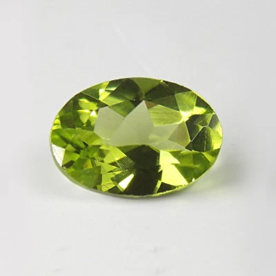 7.5 x 5.5mm OVAL FACETED GENUINE PARROT GREEN PERIDOT LOOSE GEMSTONE - Image 1 of 2