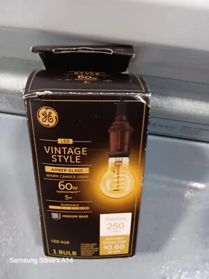 GE LED VINTAGE STYLE AMBER GLASS 60W WARM CANDLE LIGHT - Image 1 of 3