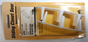 JUEGO DE 2 GUÍAS DE SUELO DE REPUESTO PARA PUERTAS CORREDERAS DE ARMARIO PARA PUERTAS DE 1 3/8" DE ESPESOR NE - Imagen 1 de 2