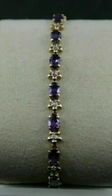 Brazalete de tenis para mujer de amatista creada en laboratorio de corte ovalado de 7 quilates enchapado en oro amarillo de 14 quilates Foto 1 de 4