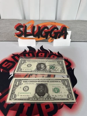 Famous Face $1 Bills firmados por Reggie Bush y Jonathan Vilma Foto 1 de 2