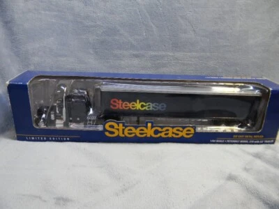 1/64 SCALE SPECCAST STEELCASE PETERBUILT MODEL 379 NAVY SEMI W/53' TRAILER-MIB - Image 1 of 4