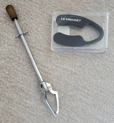 Le Creuset Black Foil Cutter, Crate & Barrel #FC 511-250 + 3 Prong Olive Utensil - Image 1 of 4